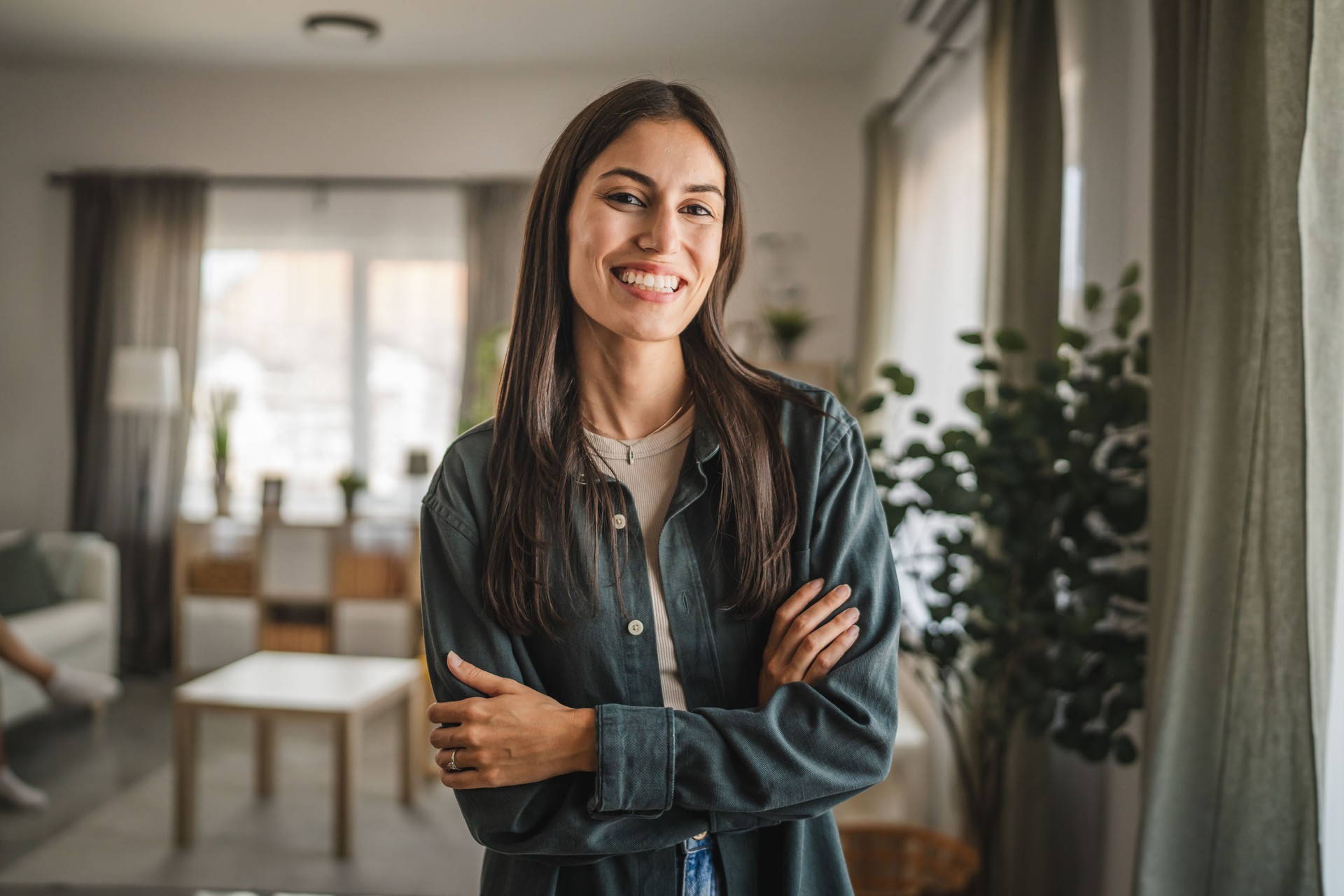 Portrait of adult young women stand and smile at home